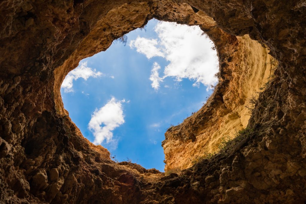 trou-Canva-Worms-eye-Photography-of-Hole-Under-Cloudy-Sky